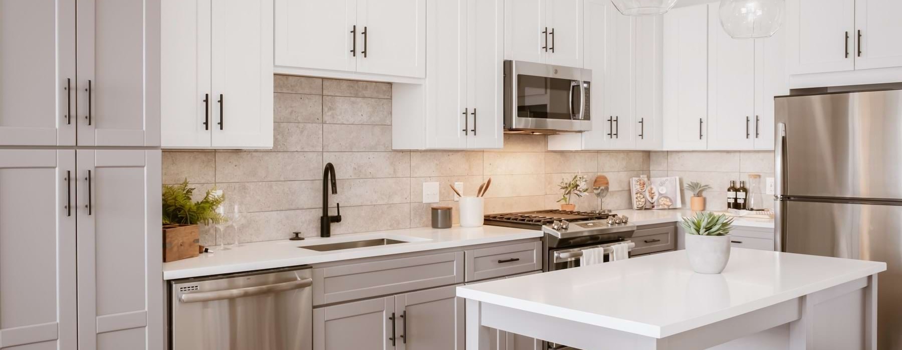 a kitchen with white cabinets