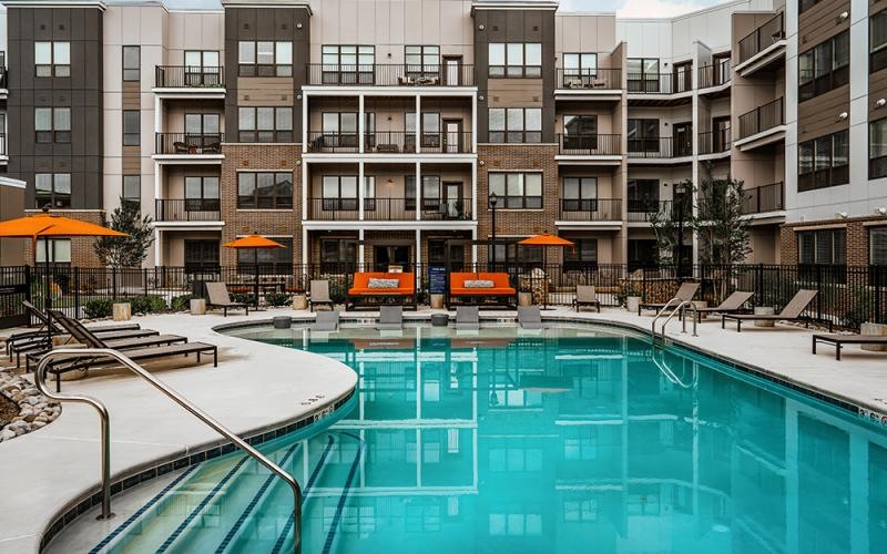 a swimming pool in front of a building